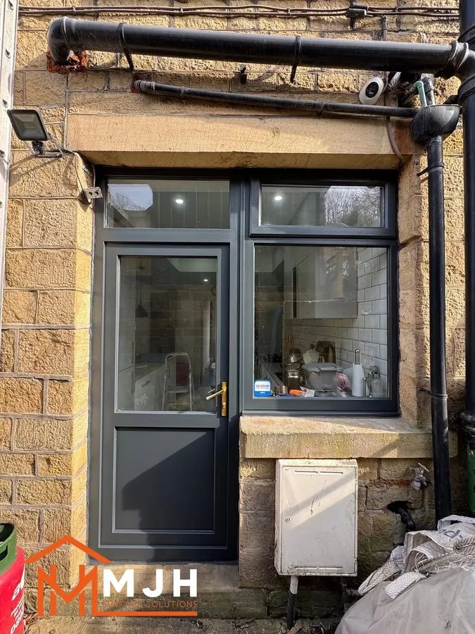 The same back door and window sprayed anthracite grey