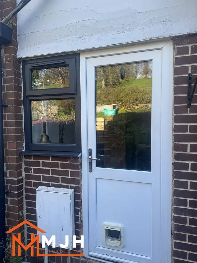 White uPVC back door and side window before spraying