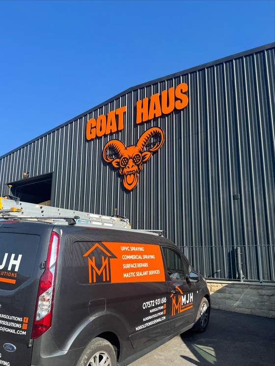 MJH Spray Solutions van parked at a commercial unit