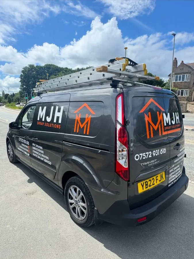MJH Spray Solutions van parked at a commercial unit